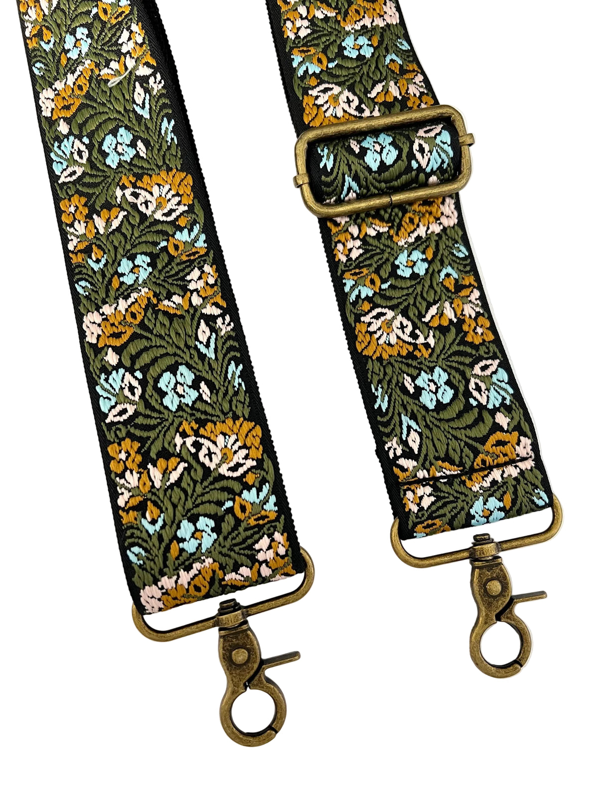 A pair of wide fabric shoulder straps with an intricate floral pattern in green, mustard yellow, light blue, and pink, finished with antique bronze metal swivel clasp connectors.